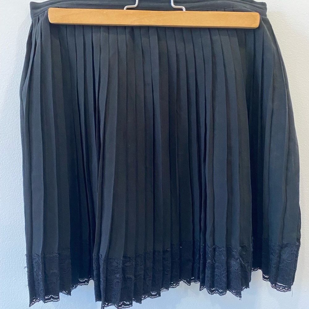 Black pleated mini skirt with lace detailing